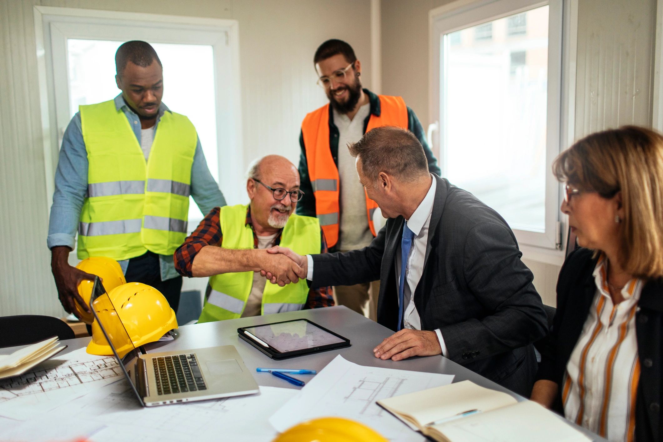 Construction team meeting around project plans